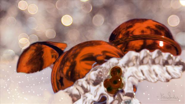 Orange Christmas Balls in the snow with bokeh background